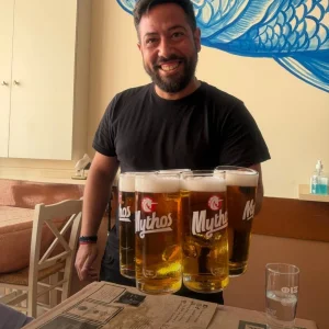 Our waiter with local beer